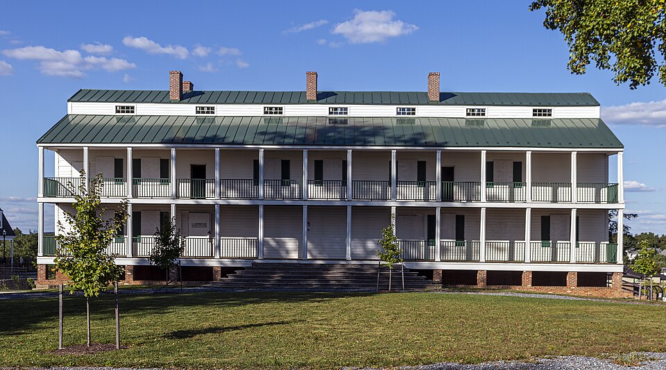 Wide exterior of Landon House with its long two-level porch in Urbana, Maryland.