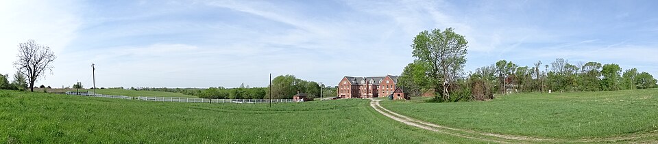 Very wide panorama of the grounds at Belvoir Winery in Liberty, Missouri, with the main building in the distance; retain full panorama context.