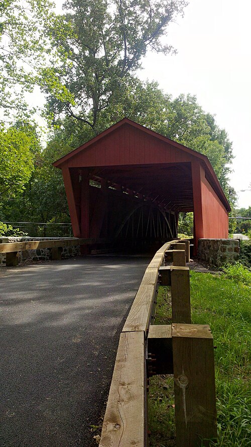 Road approaching the red Jericho Covered Bridge, Maryland.