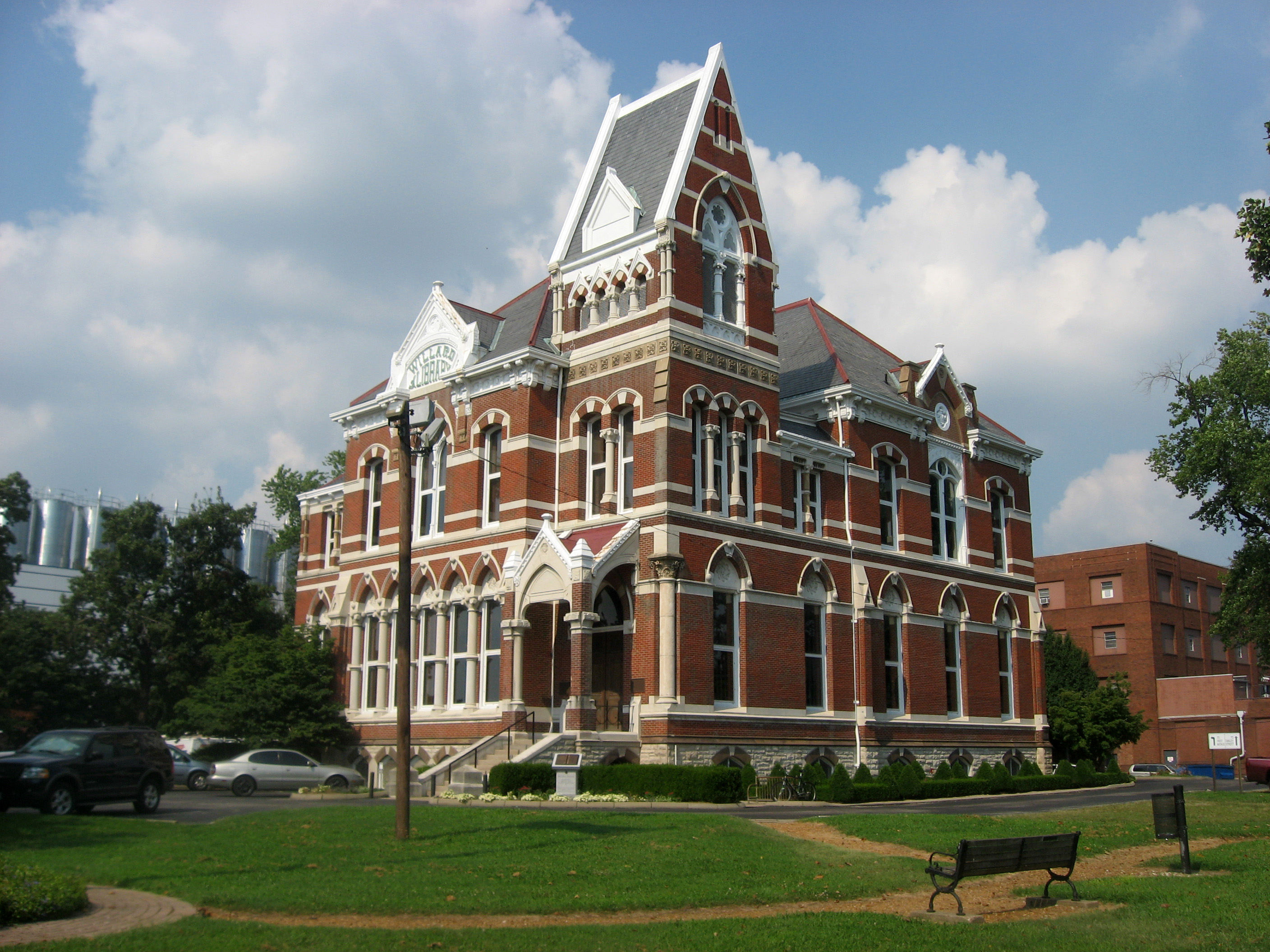 Willard Public Library red brick and stone exterior with its distinctive tower in Evansville, Indiana.