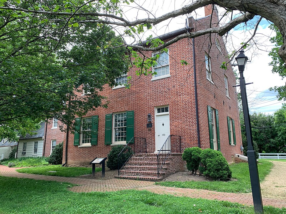 Beall-Dawson House red brick exterior and green shutters in Rockville, Maryland.