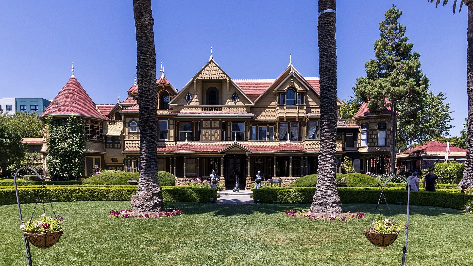 The Victorian façade and gardens of Winchester Mystery House in San Jose.